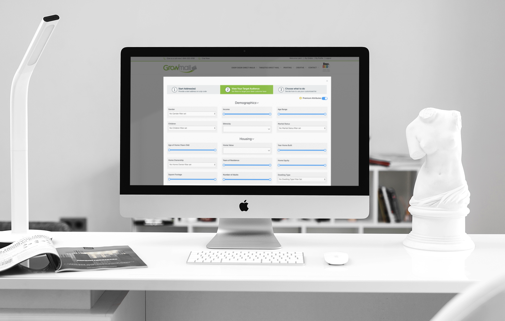 An iMac desktop in an modern office with targeted direct mail software.